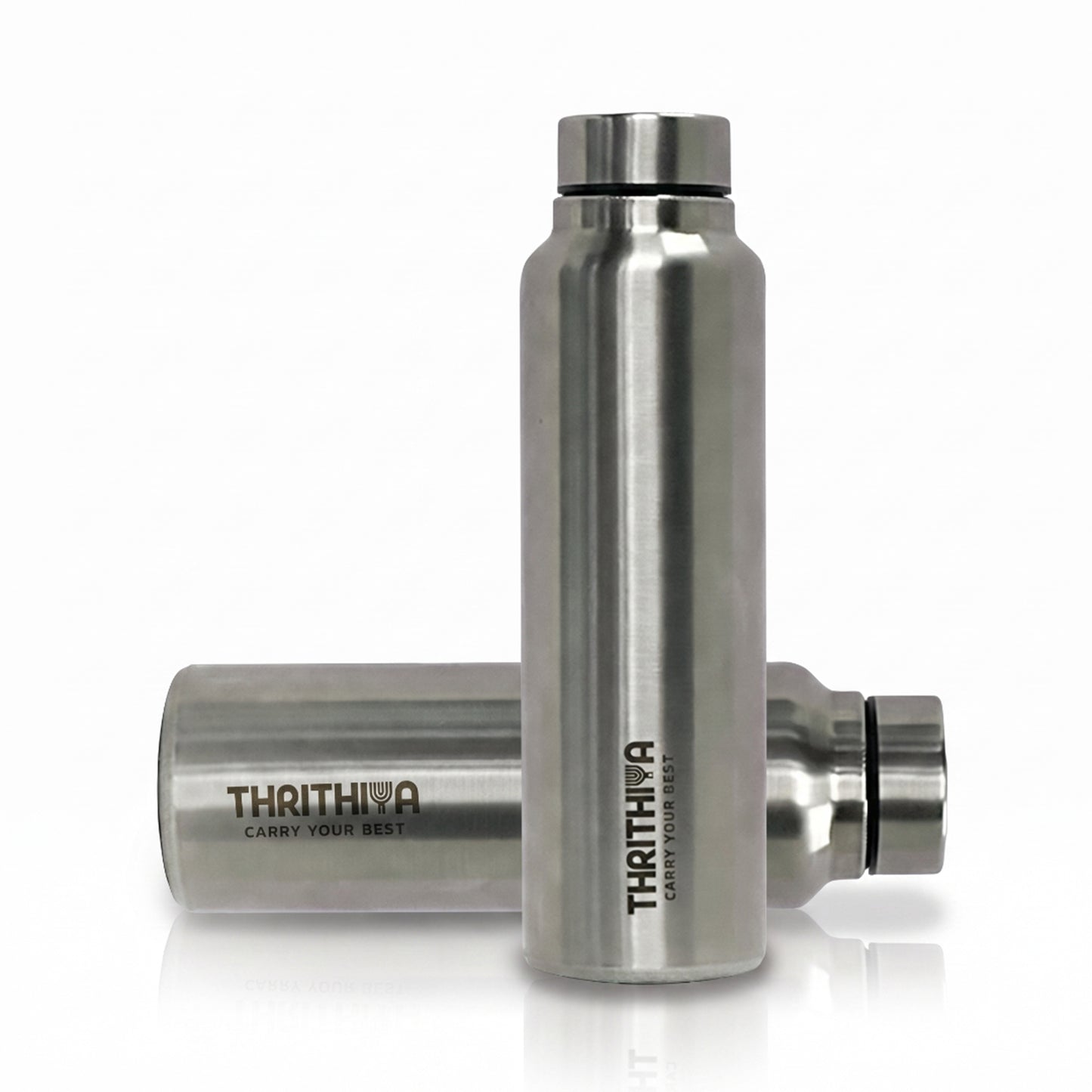 Two stainless steel water bottles from Thrithiva on a clean white background. One bottle is standing upright in the foreground, and the other lies horizontally behind it.